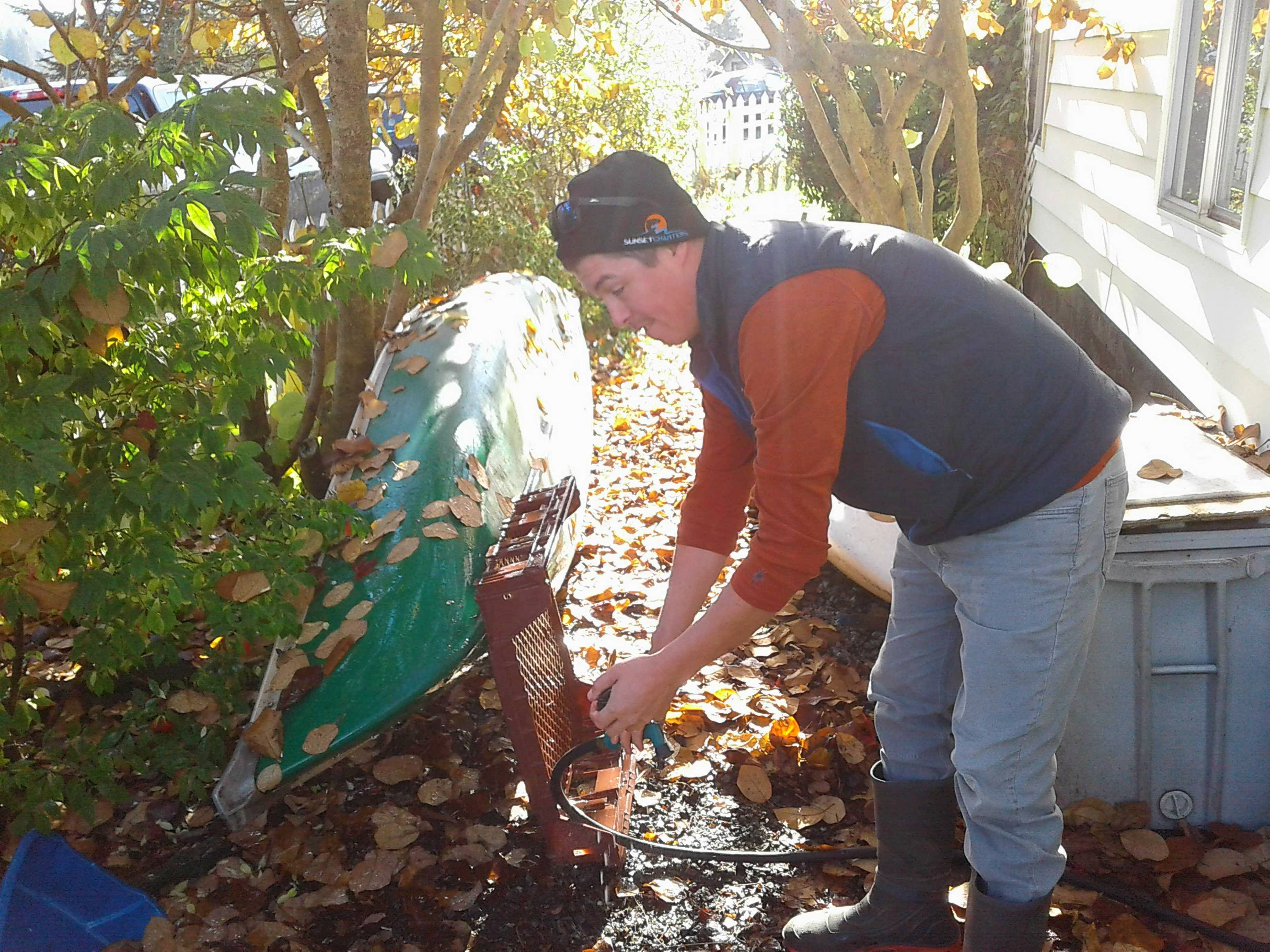 A man cleaning with a hose