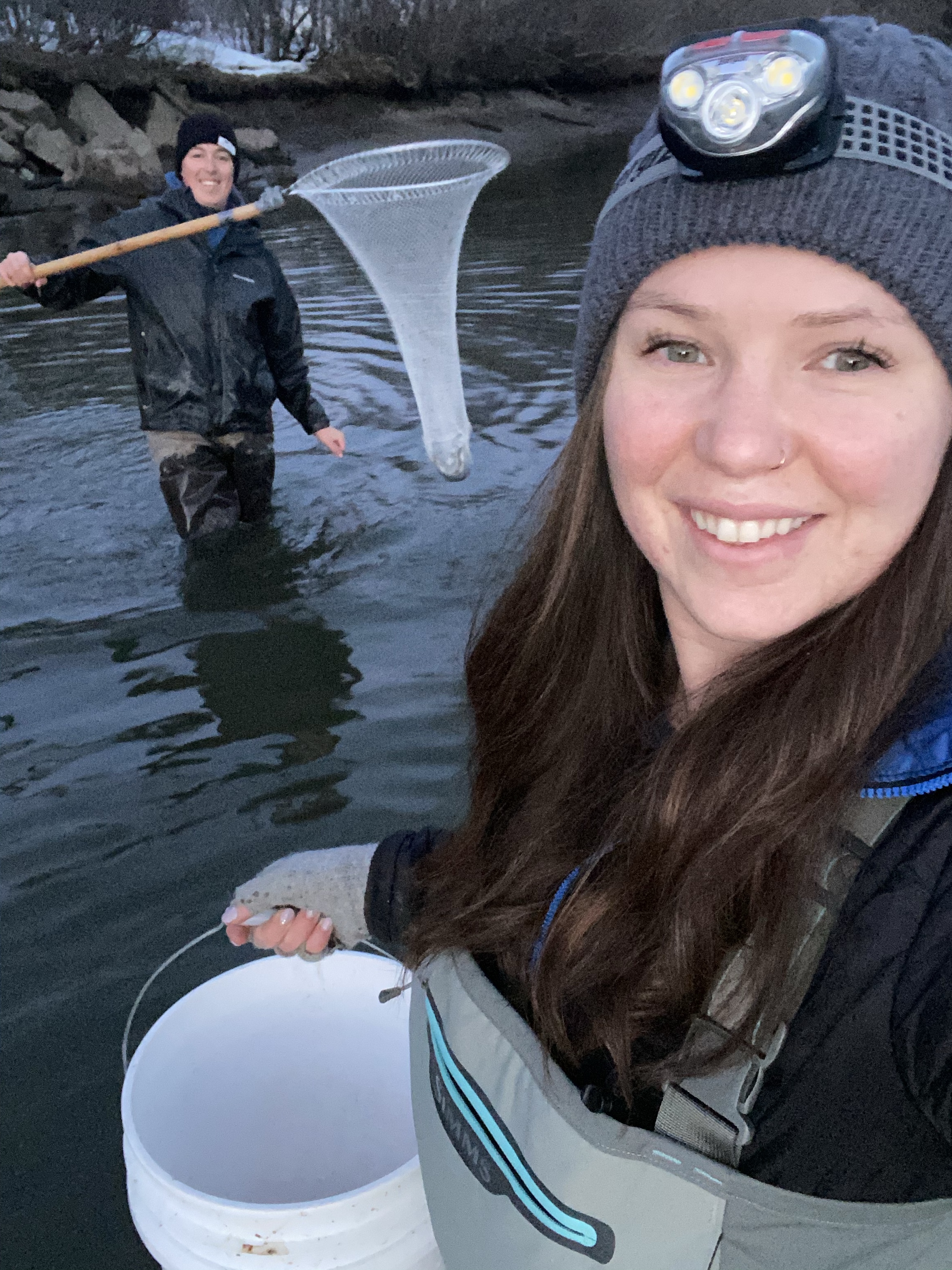 A lady holding a basket and A man grabbing a net