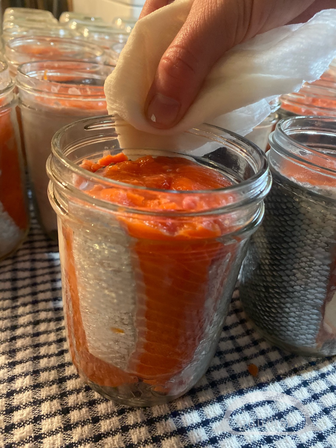 placing a lids on the jars