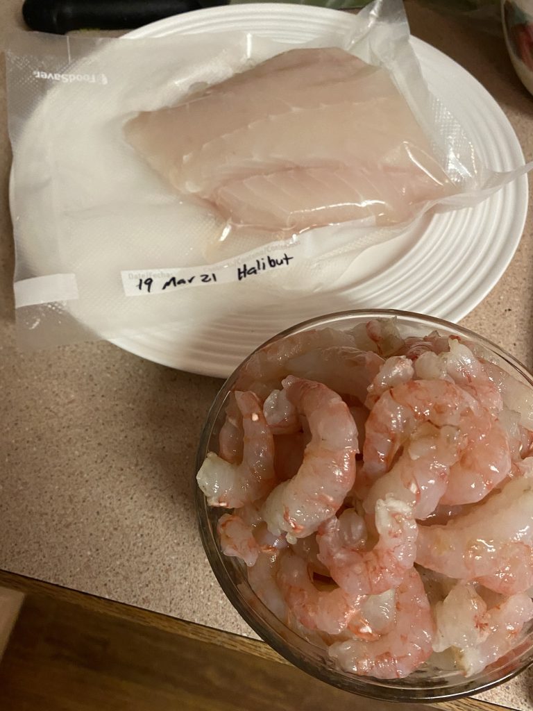 Peeled prawn and frozen halibut
