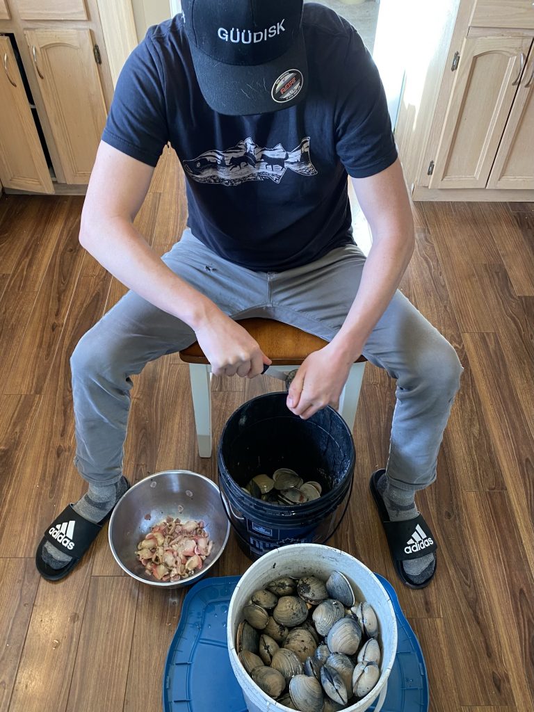 Stephen shucking a bucket of ts'a̱'a̱x